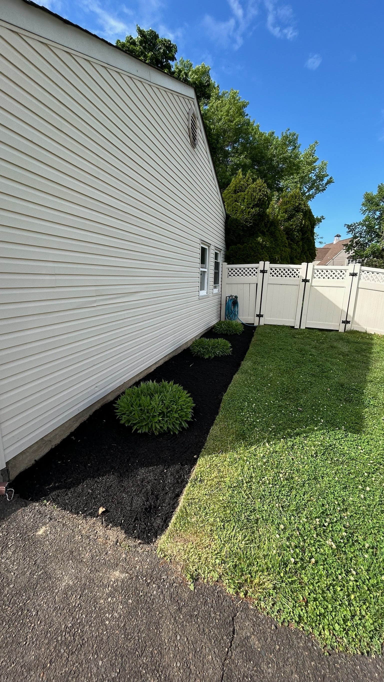 Completed landscaping project with fresh plantings