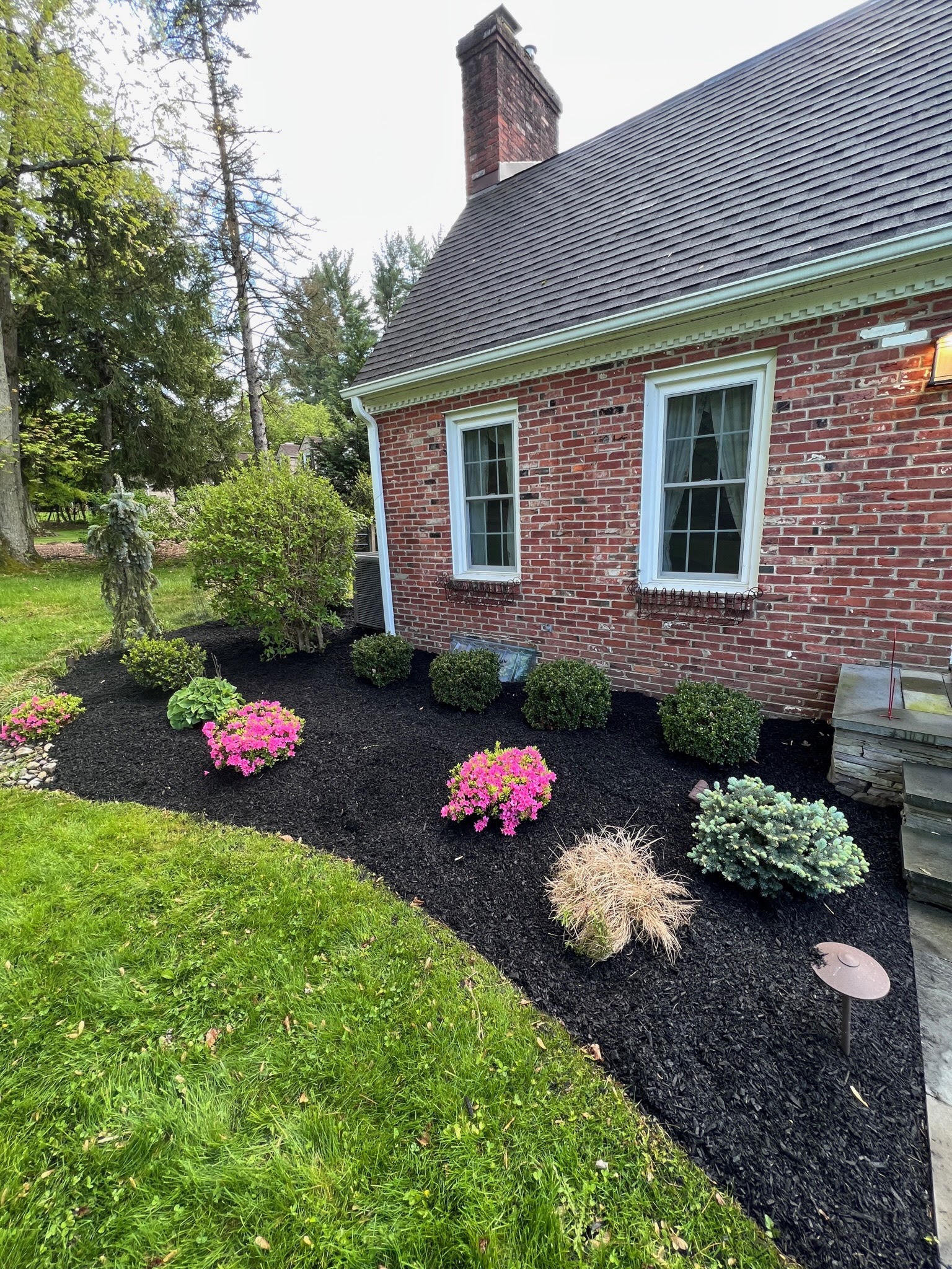 Mulch bed with colorful flower plantings